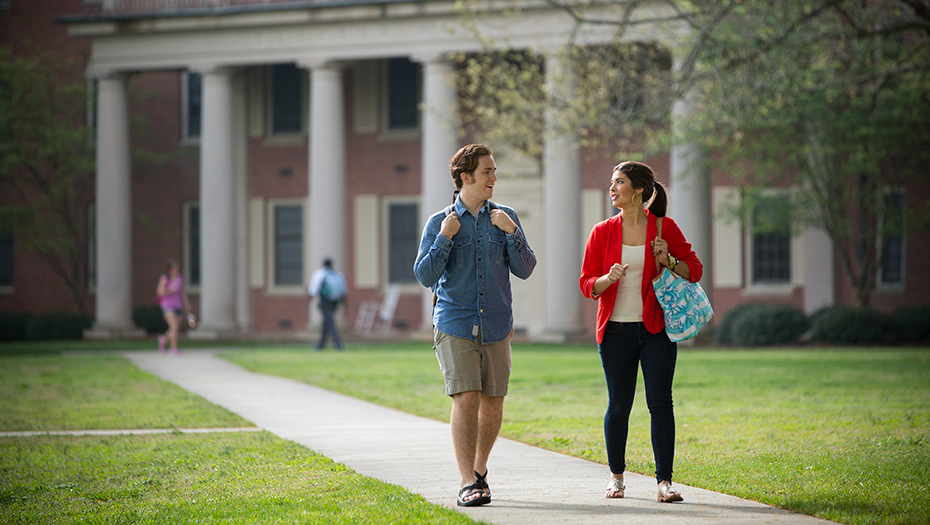 Image of two people walking - via https://www.presby.edu/about/at-a-glance/